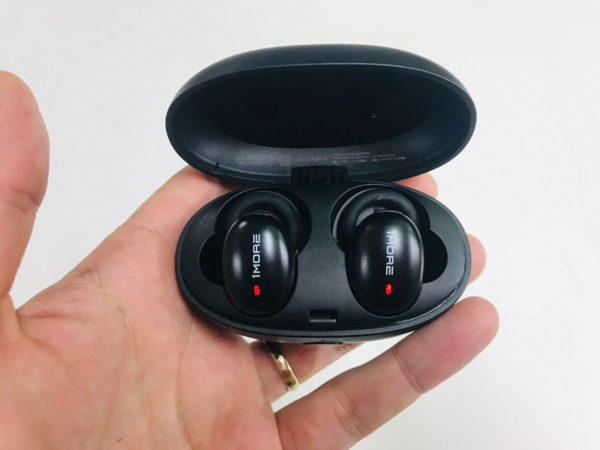 1More Stylish True Wireless Earbuds charging in case