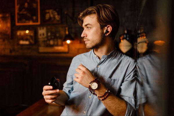 model wearing xfyro earbuds