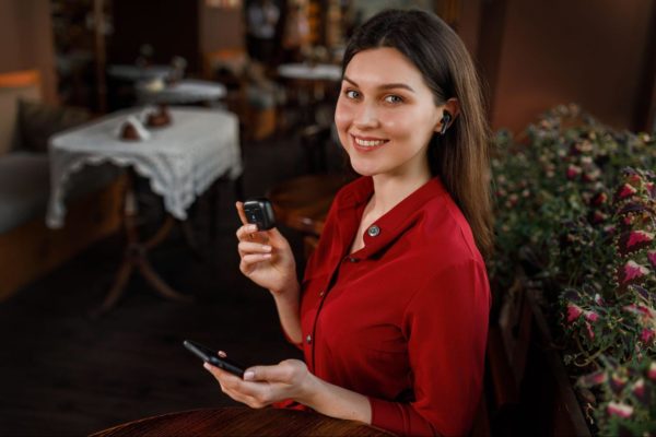 woman with xfyro earbuds