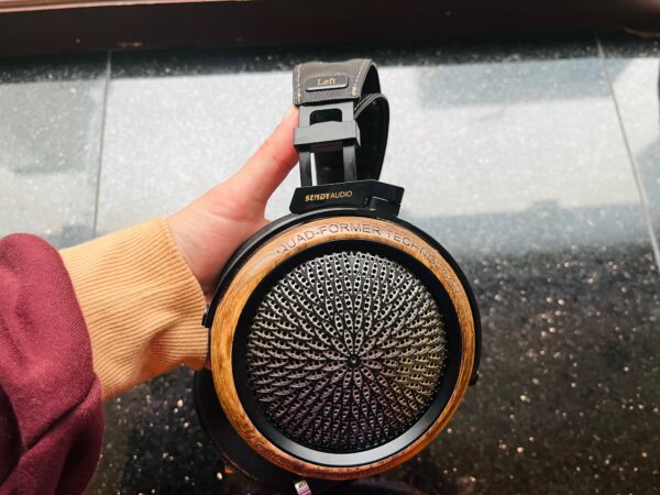 Sendy Audio Peacock Sports a wooden ear cup with machined aluminum grill